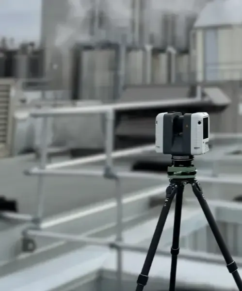 Smartphone mounted on a tripod overlooking a blurred city rooftop skyline