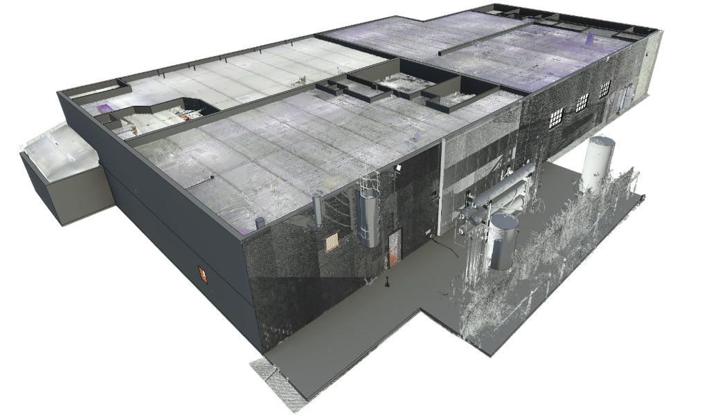 Industrial building exterior with dark panels and glass walls, shown from an elevated angle