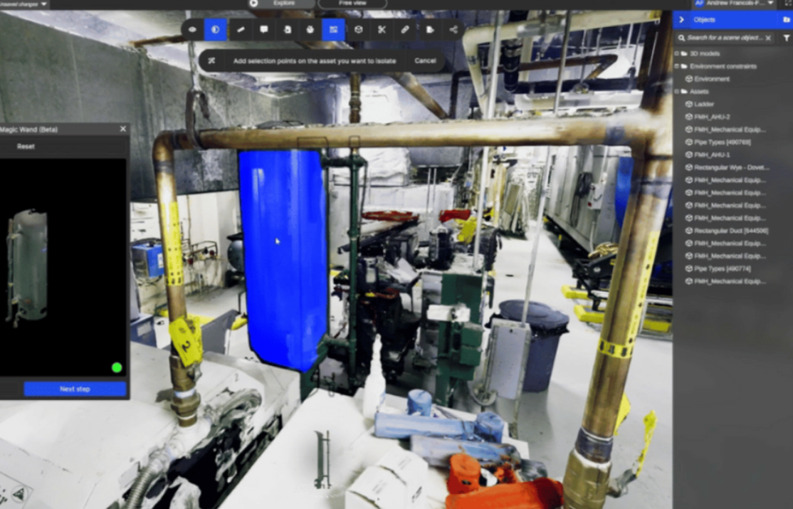 Industrial equipment room with a large bright blue machine and pipes in a factory setting