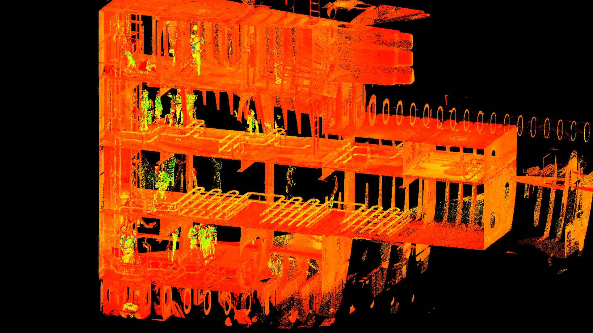 Orange-lit industrial building against a black background, shown in a side view with bright structural details.