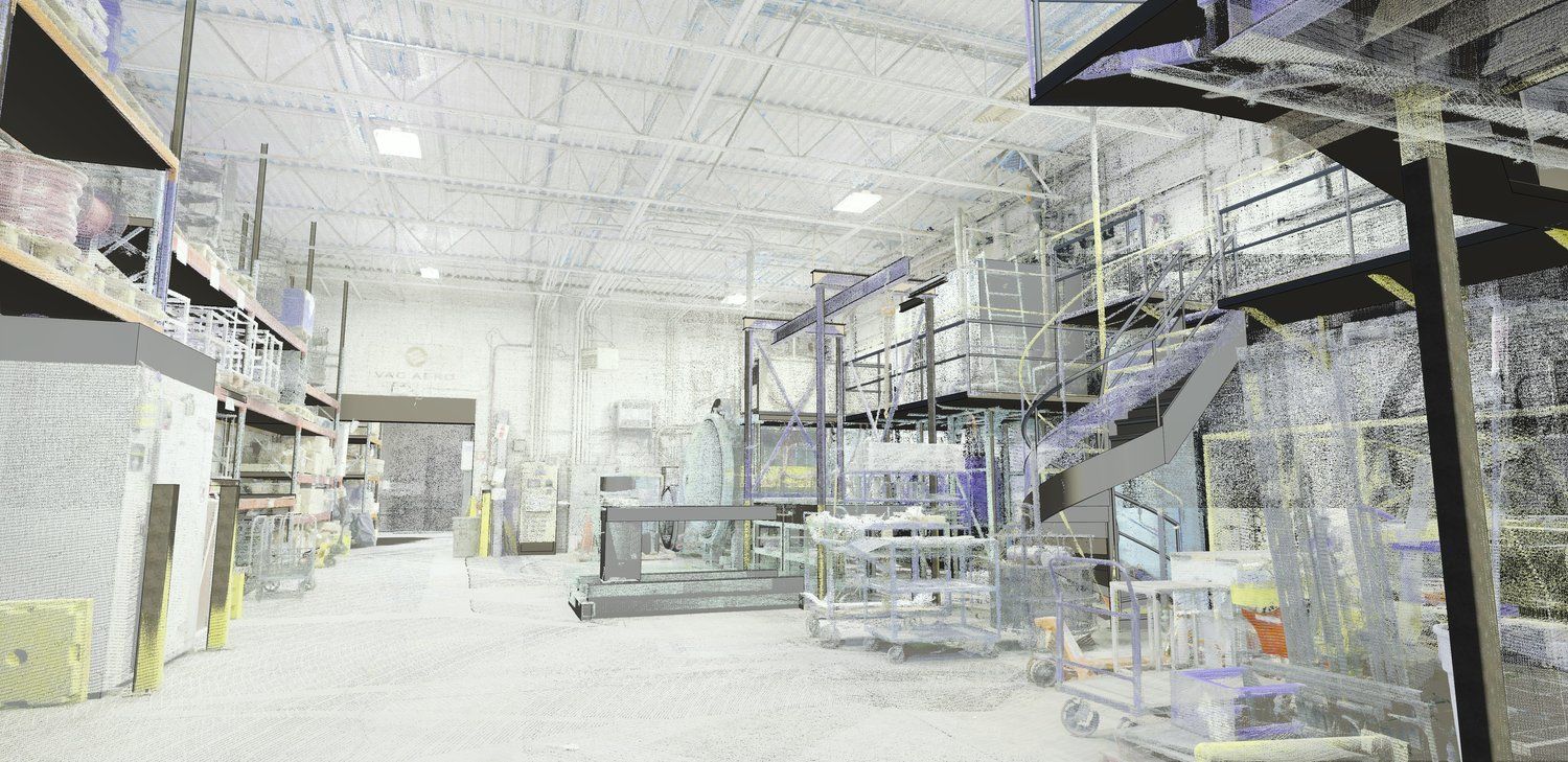 Bright warehouse aisle with metal shelving, pallets, and industrial equipment under fluorescent lights