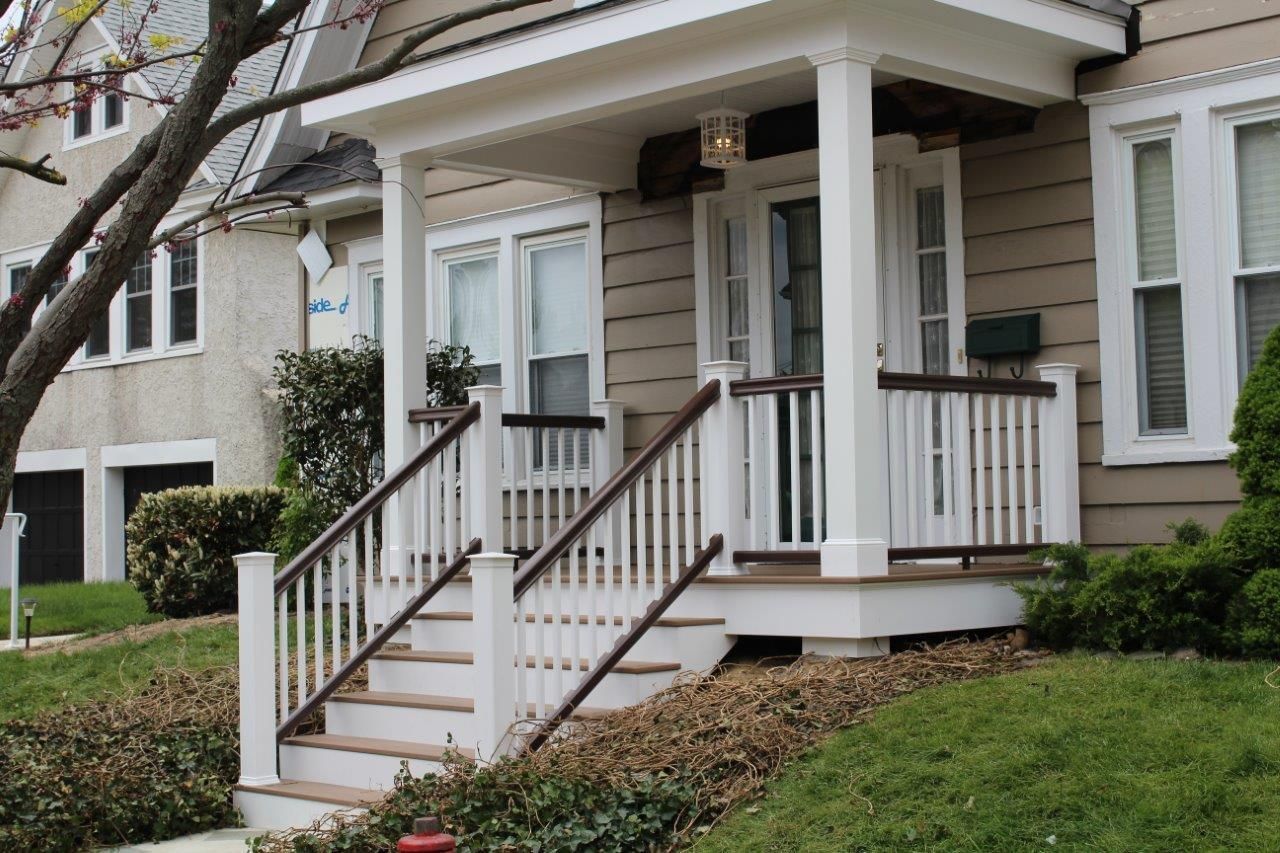 A house with a porch and stairs leading up to it