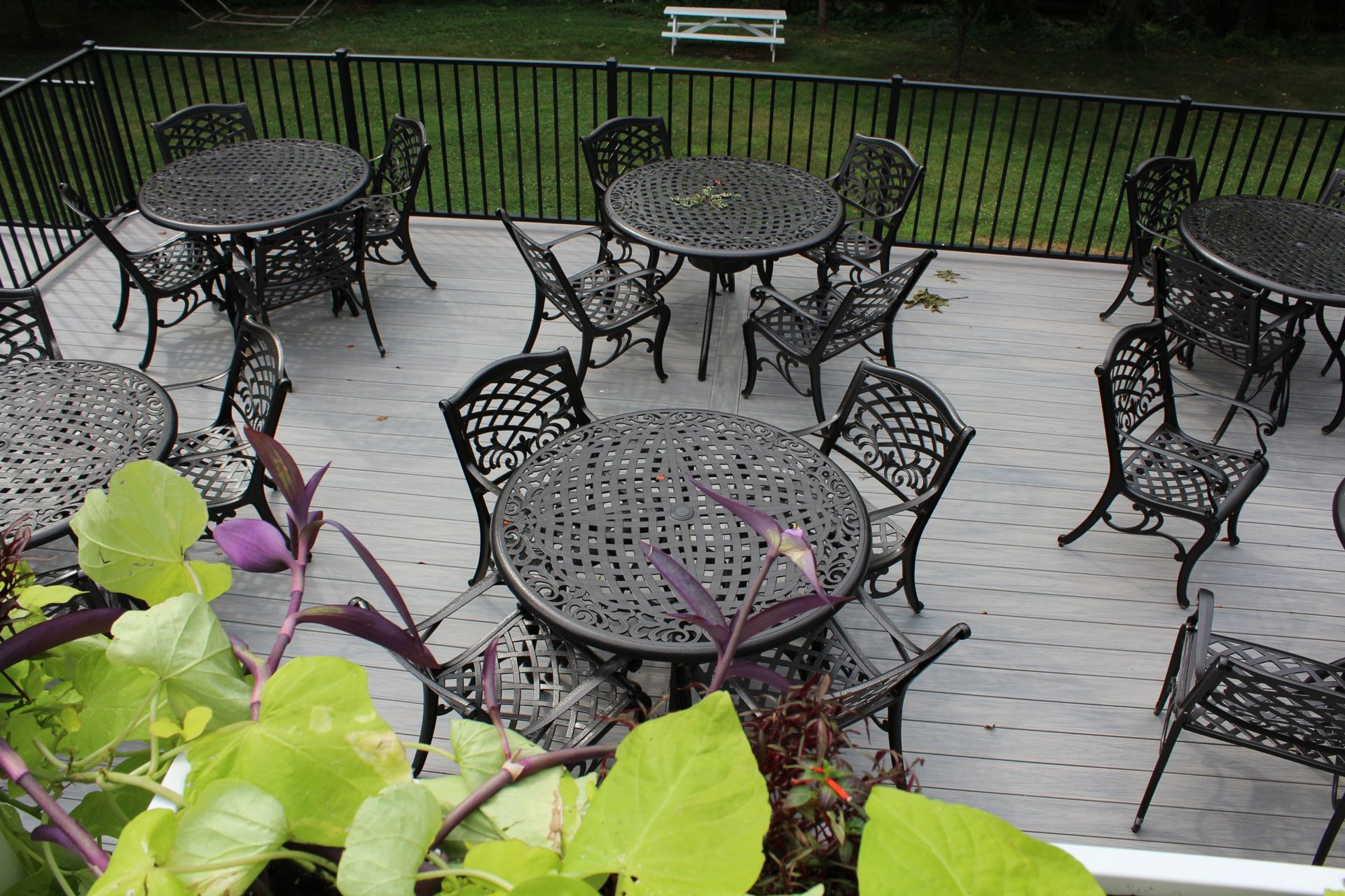 White-railed elevated deck with wide staircase.