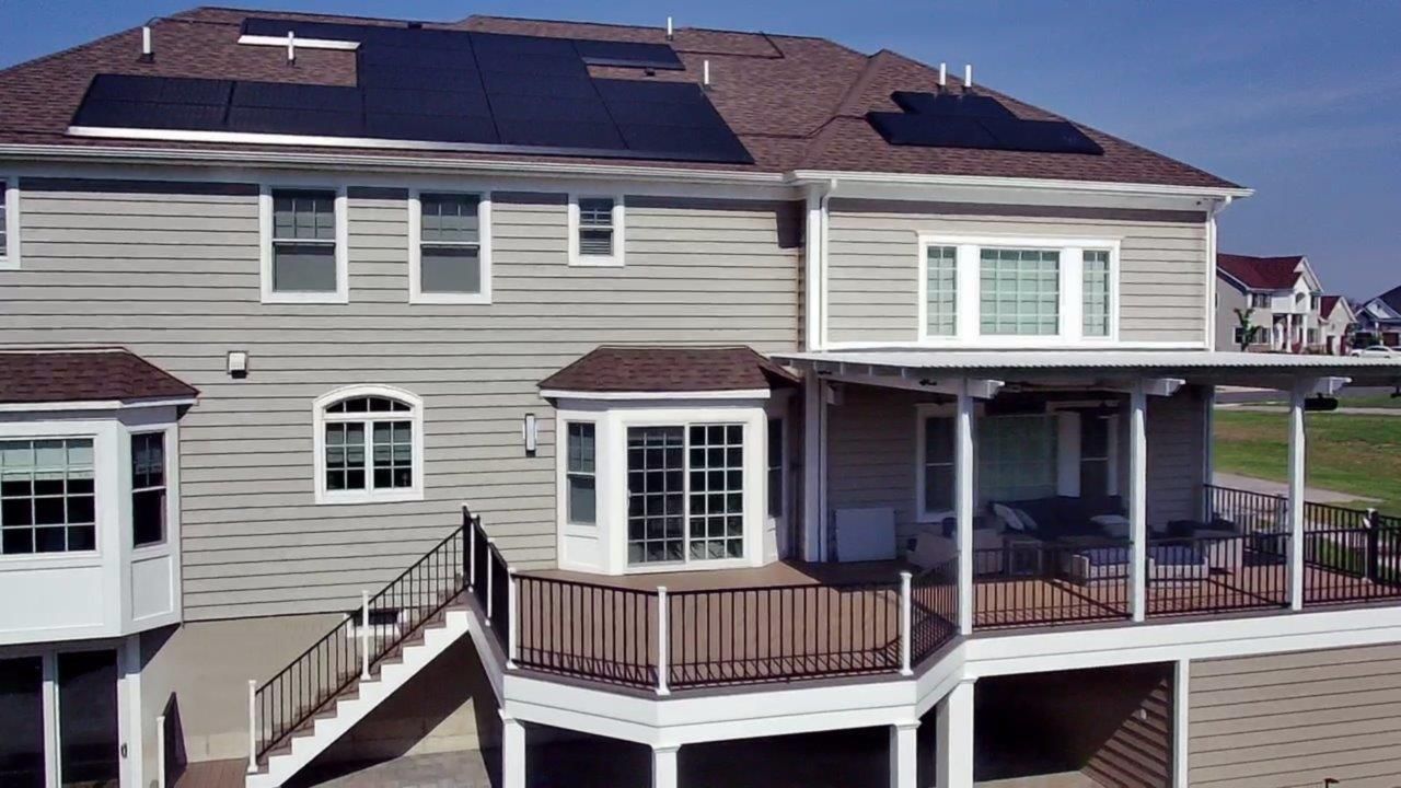 A large house with solar panels on the roof