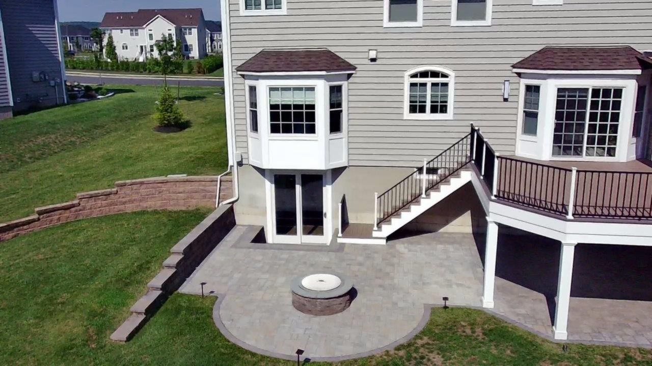 An aerial view of a house with a patio and stairs