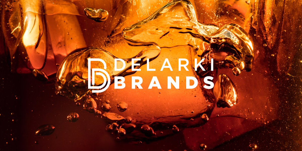 Macro of a drink with the Delarki Brands logo over