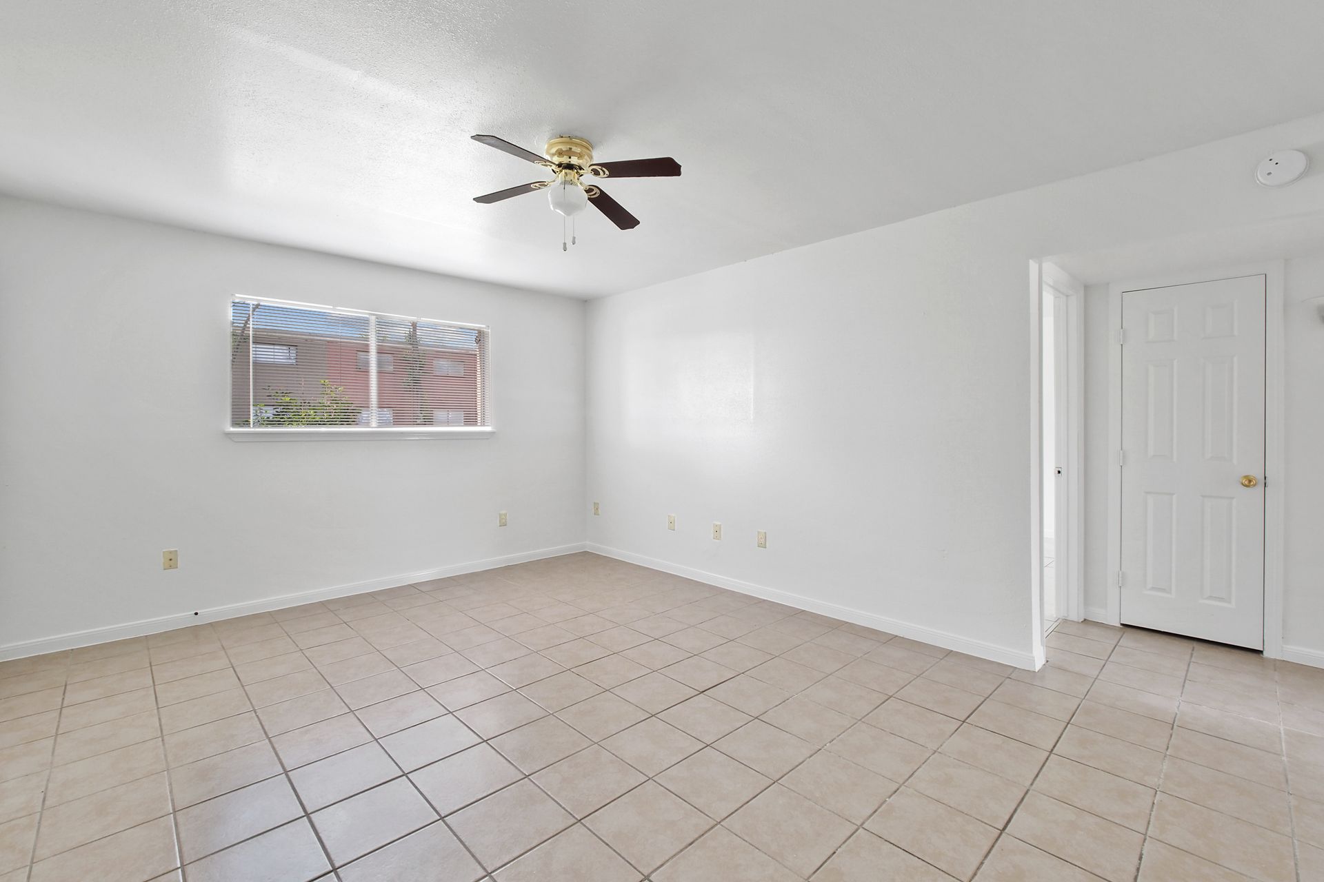 Interior Photo of Empty Room with Ceiling Fan