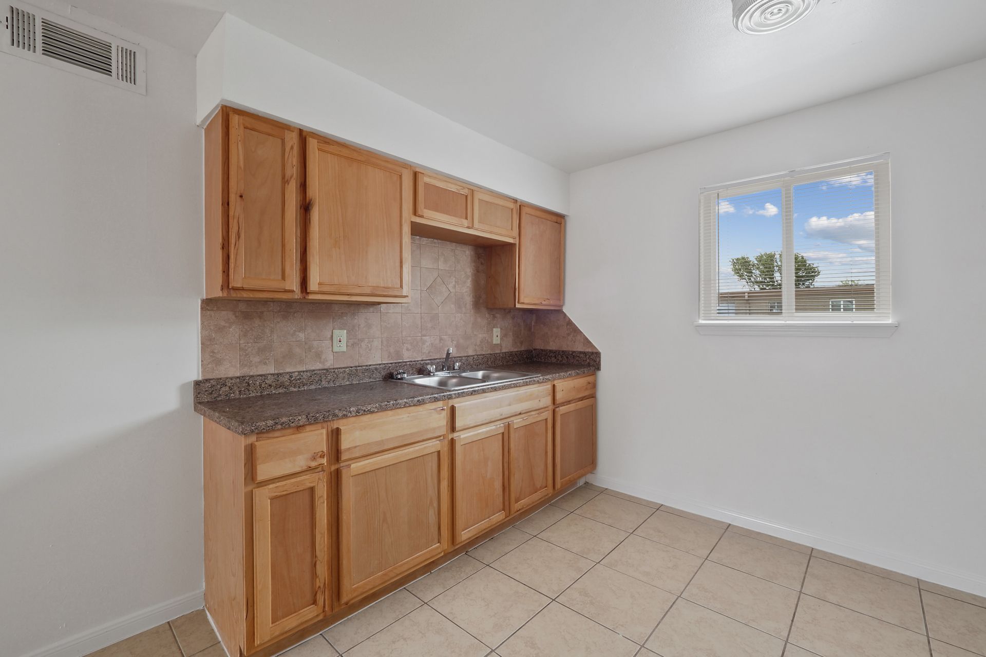Interior Photo of Kitchen with Light Brown Cabinets