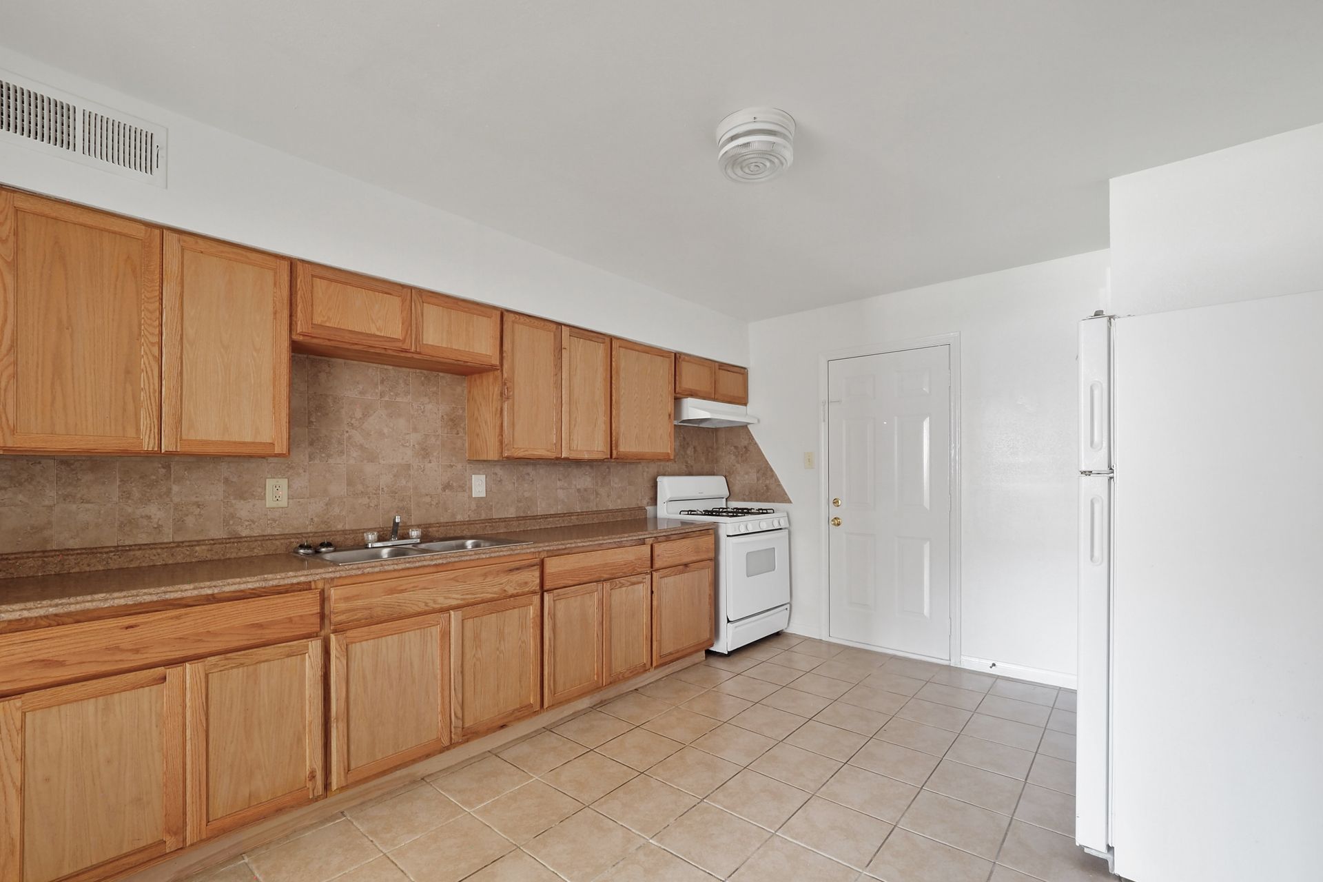 Interior Photo of Kitchen with Light Brown Cabinets