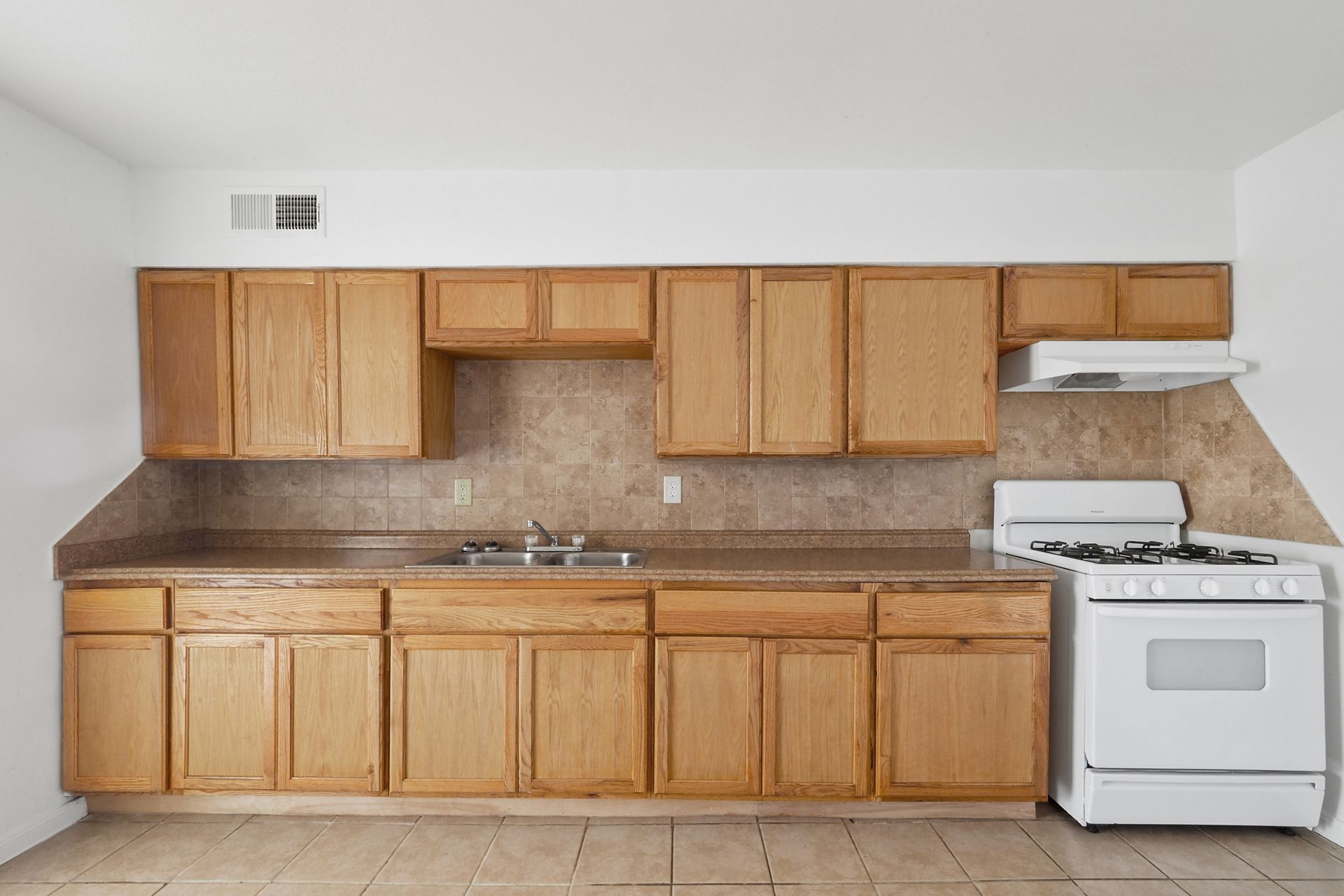 Interior Photo of Kitchen with Light Brown Cabinets