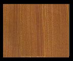 Wooden square with vertical grain in warm brown hues.