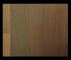 Wooden floorboards, varying shades of brown and tan, with visible grain.