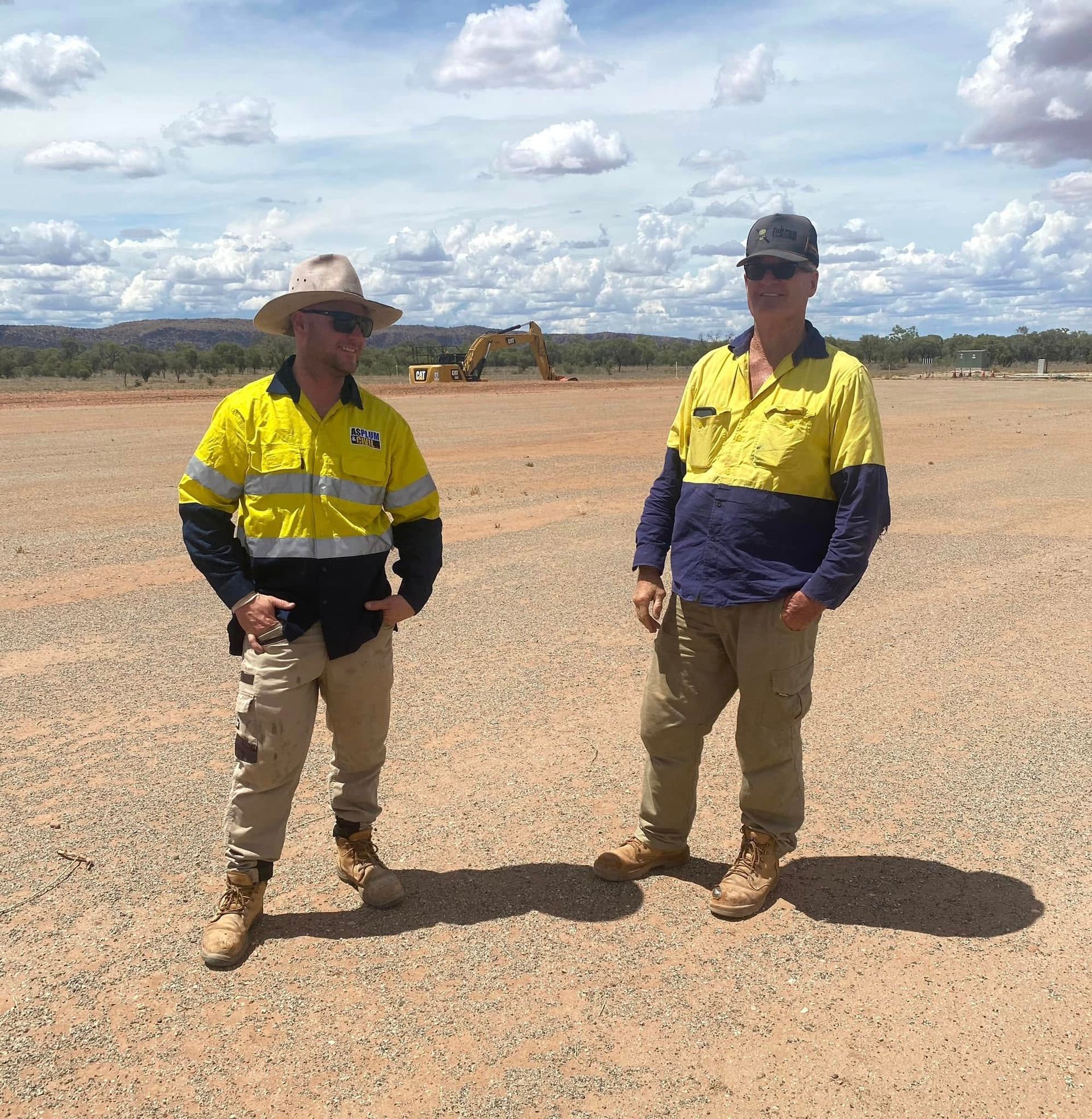 Two Men Are Standing Next to Each Other — ASPLUM & CIVIL In Alice Springs, NT