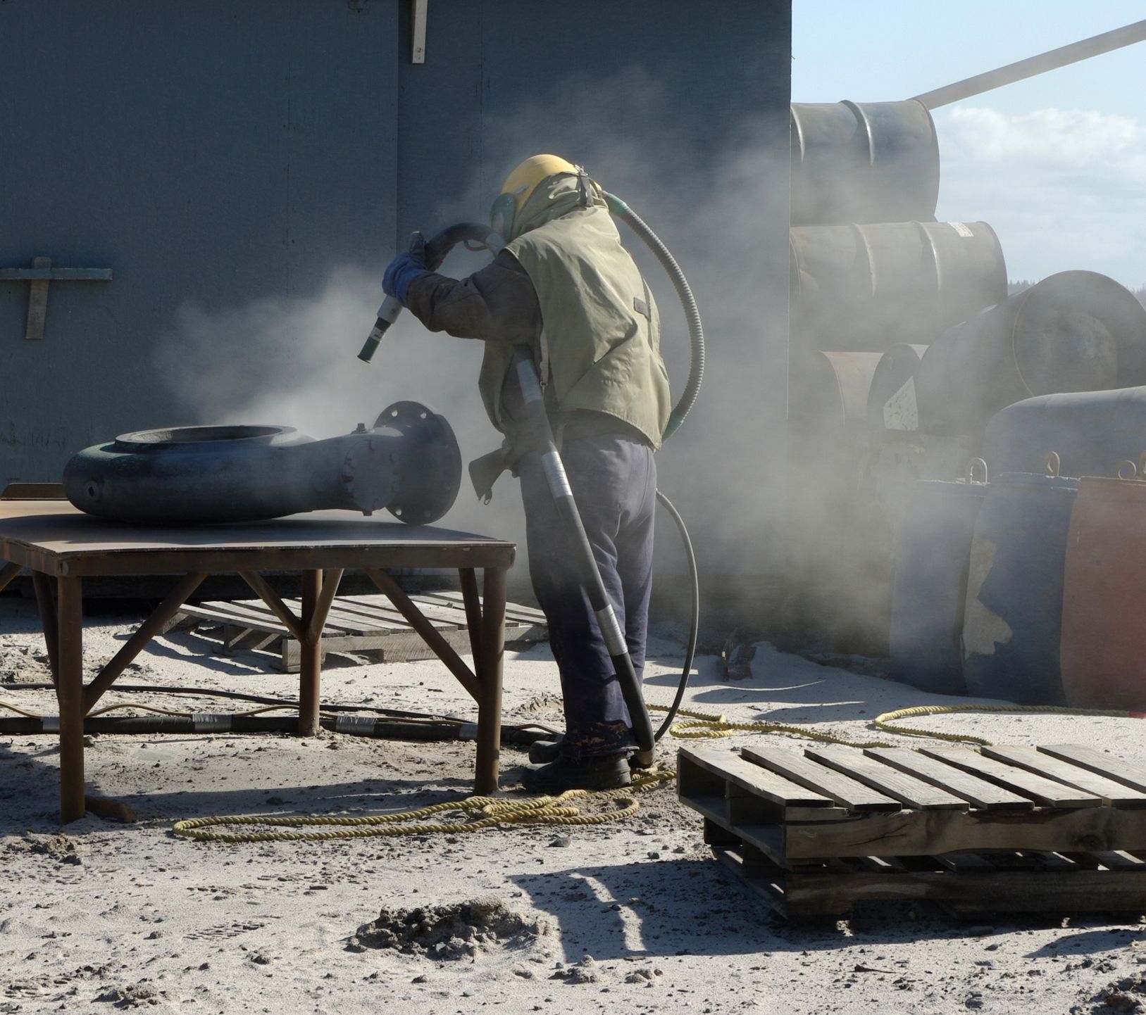 Man Using Sand Blasting — Brewster, NY — Tri County Carting Sand Blasting & Welding Services