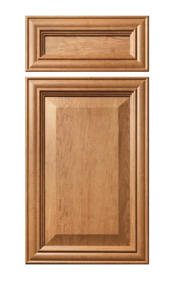 Wooden cabinet doors in a light oak finish, one small drawer above a larger panel door.