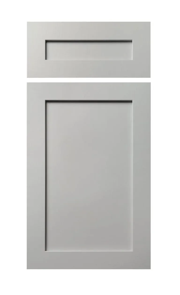 Gray cabinet door with a recessed rectangular panel and a slim drawer above it.