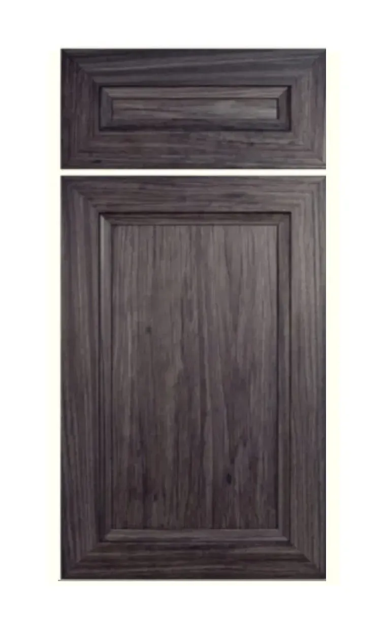 Dark wood cabinet door with a raised panel and a small drawer above it