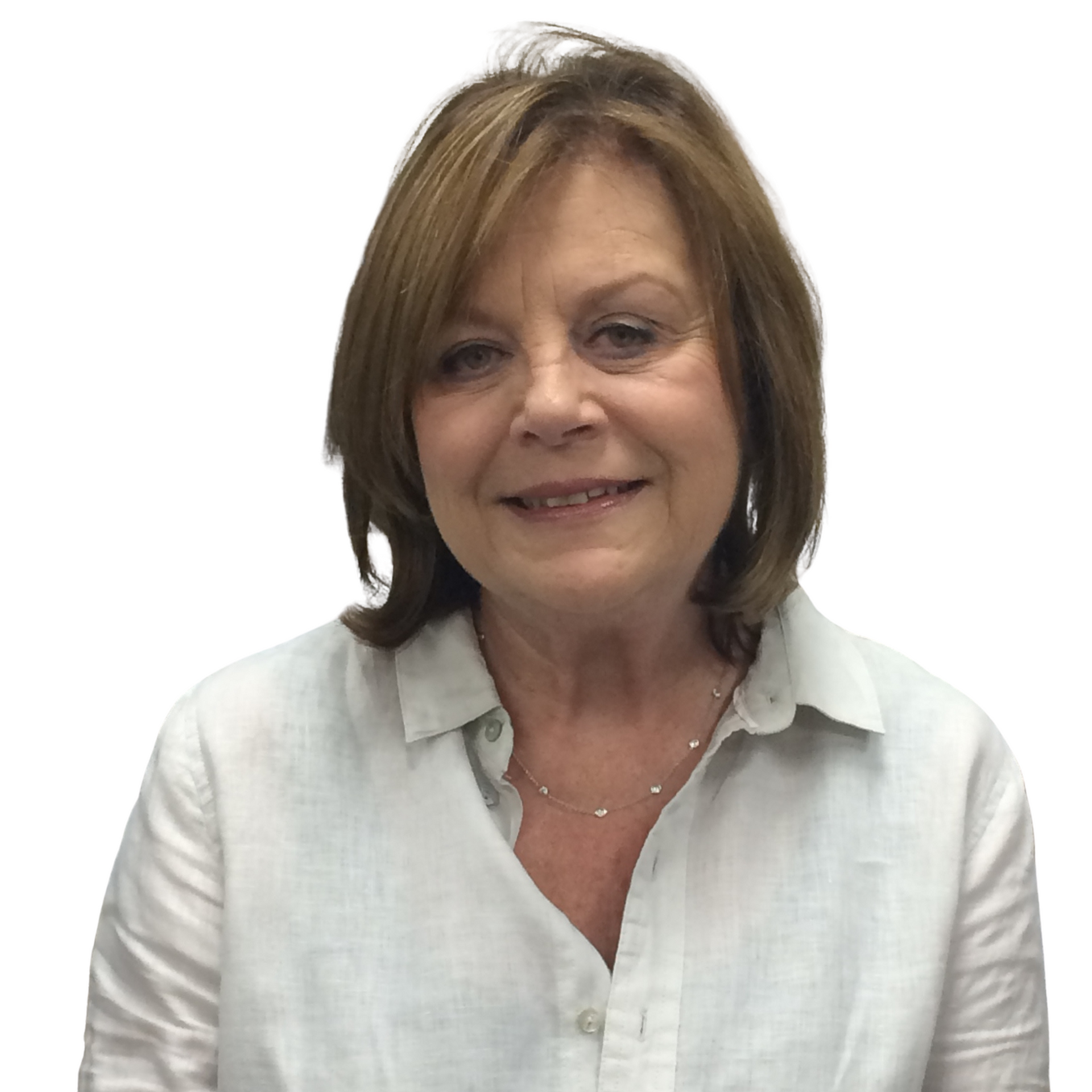 A woman in a white shirt is smiling in front of a picture of a cruise ship.