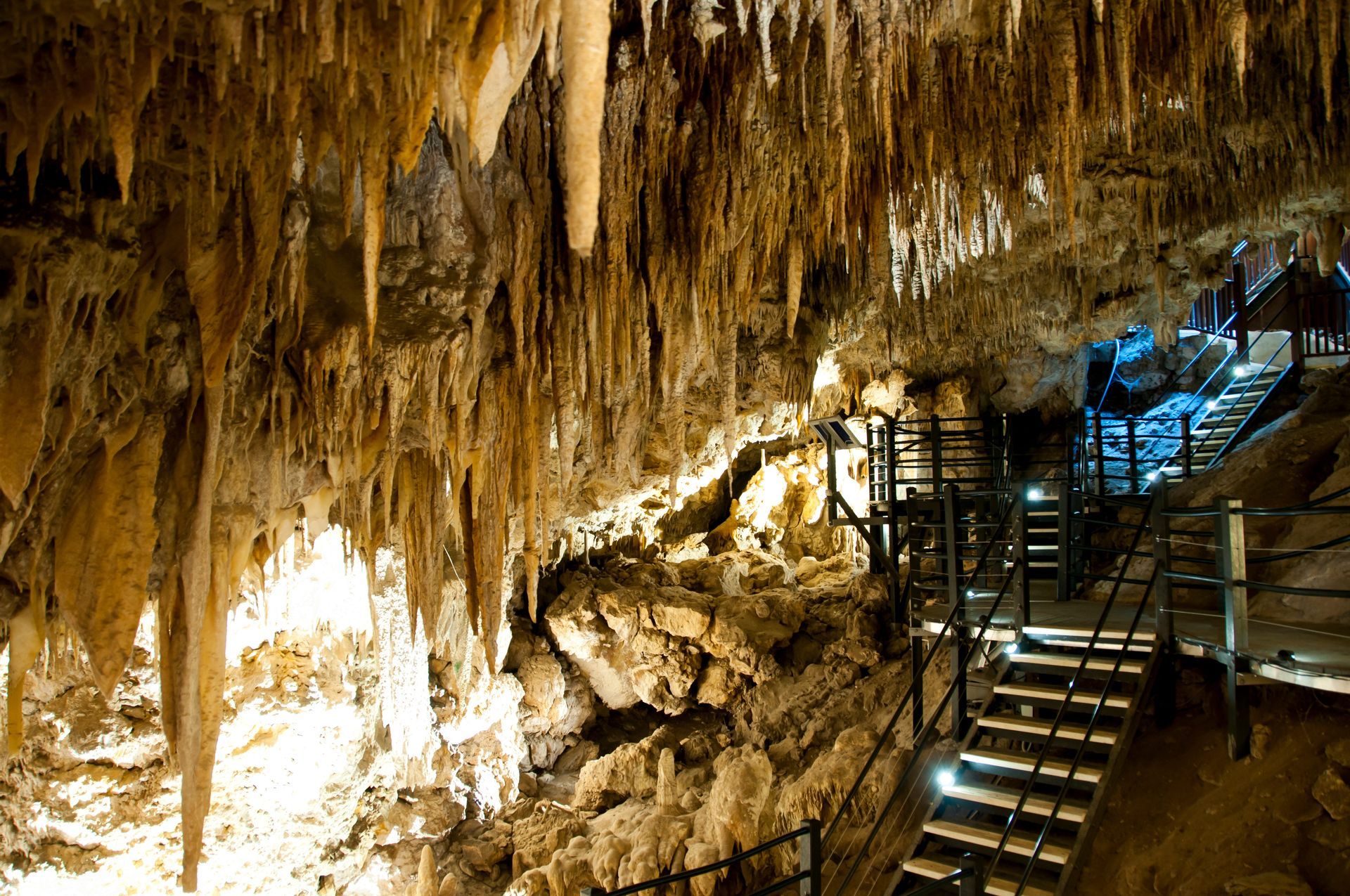 A cave with stairs leading up to the top of it