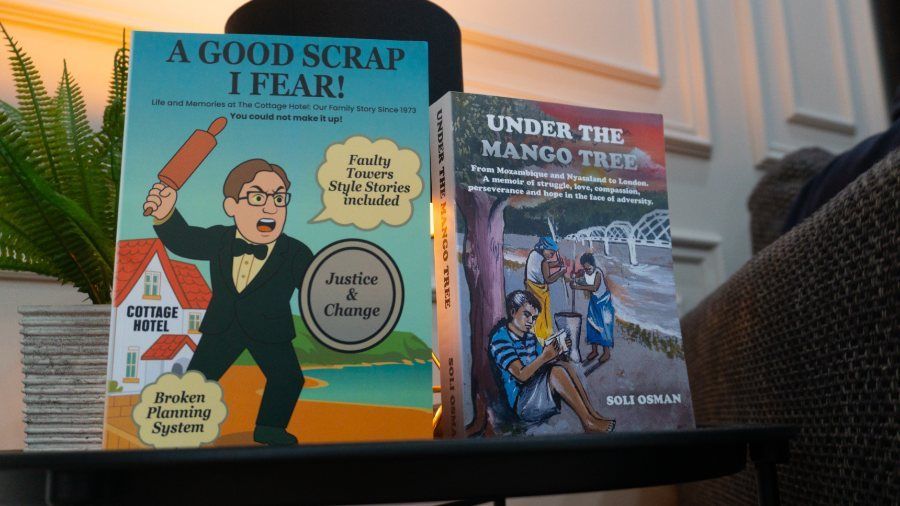 Two finished client books, A Good Scrap I Fear and Under the Mango Tree, on a side table