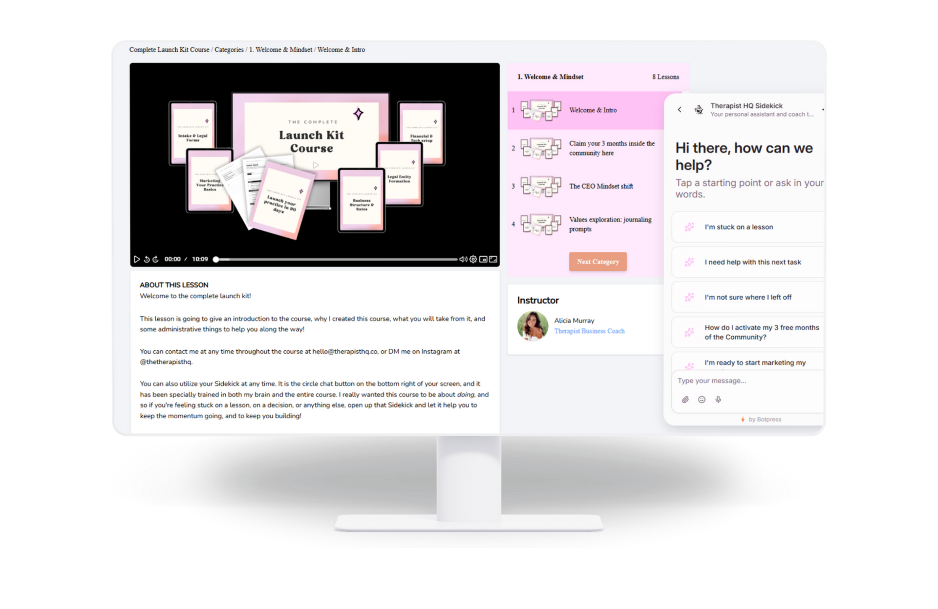 Website mockup on a desktop monitor with a pink sidebar and content panel