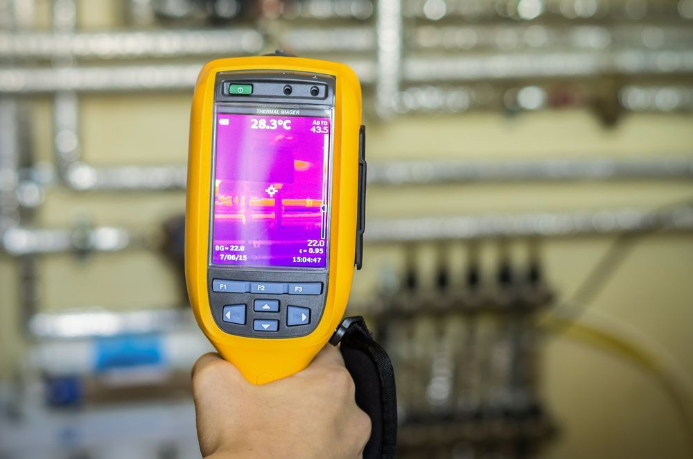 A Person is Holding a Thermal Camera in Their Hand — Accredited Plumbing in Milton, NSW