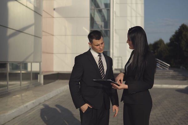 man and woman discussing commercial leasing