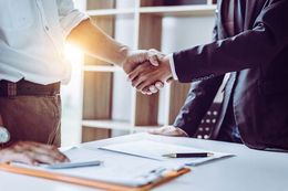 two people shaking hands