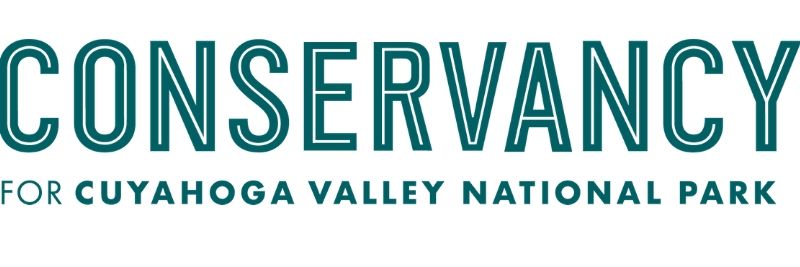 Logo for Conservancy for Cuyahoga Valley National Park, teal letters with white outline.