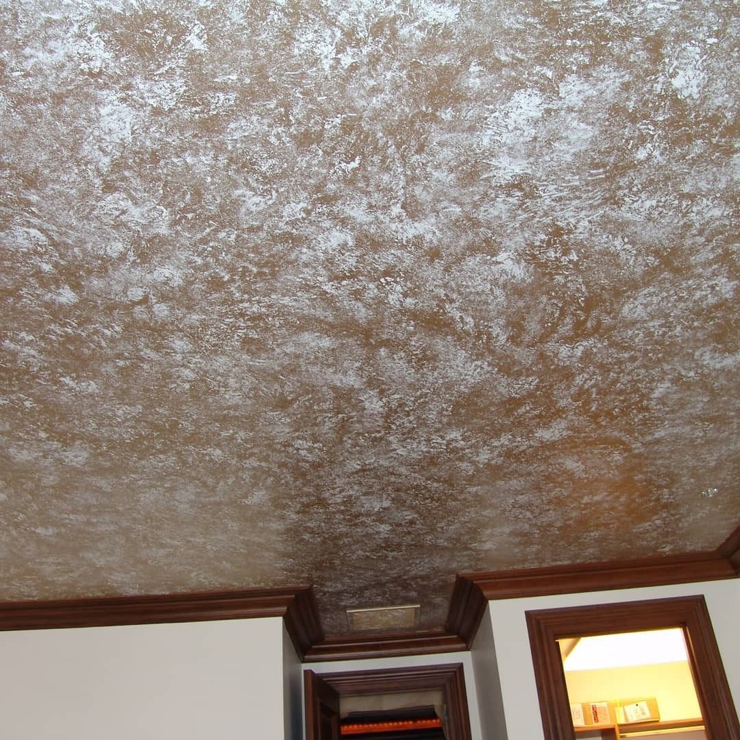 Brown and silver textured ceiling with wood trim and accents.