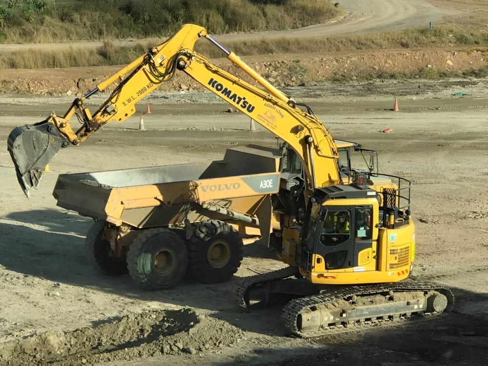 A Yellow Komatsu Excavator — Adam Lowe Earthmoving Pty Ltd in Somersby, NSW