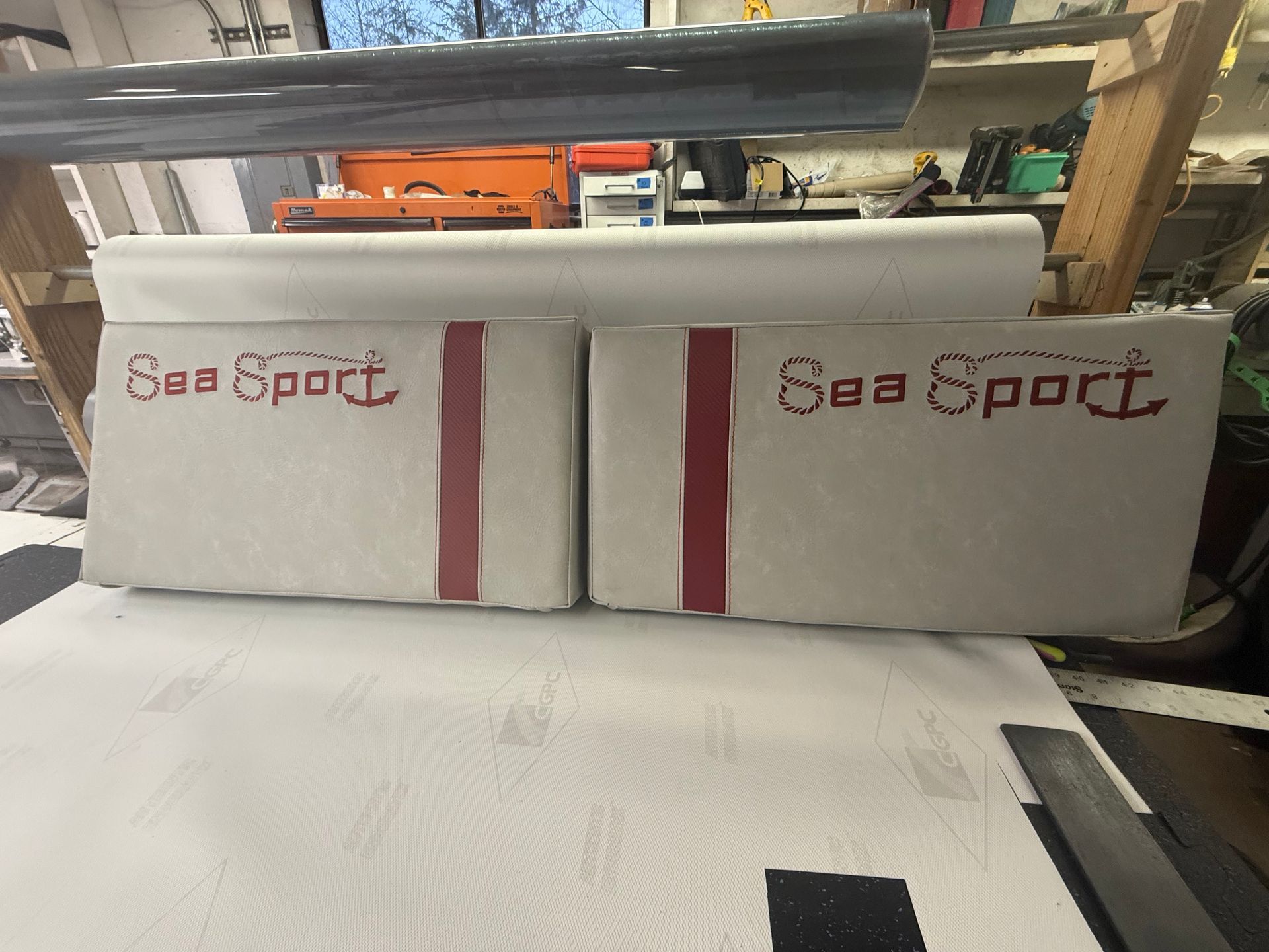 Cream Sea Sport cushion backs with red accent stripes