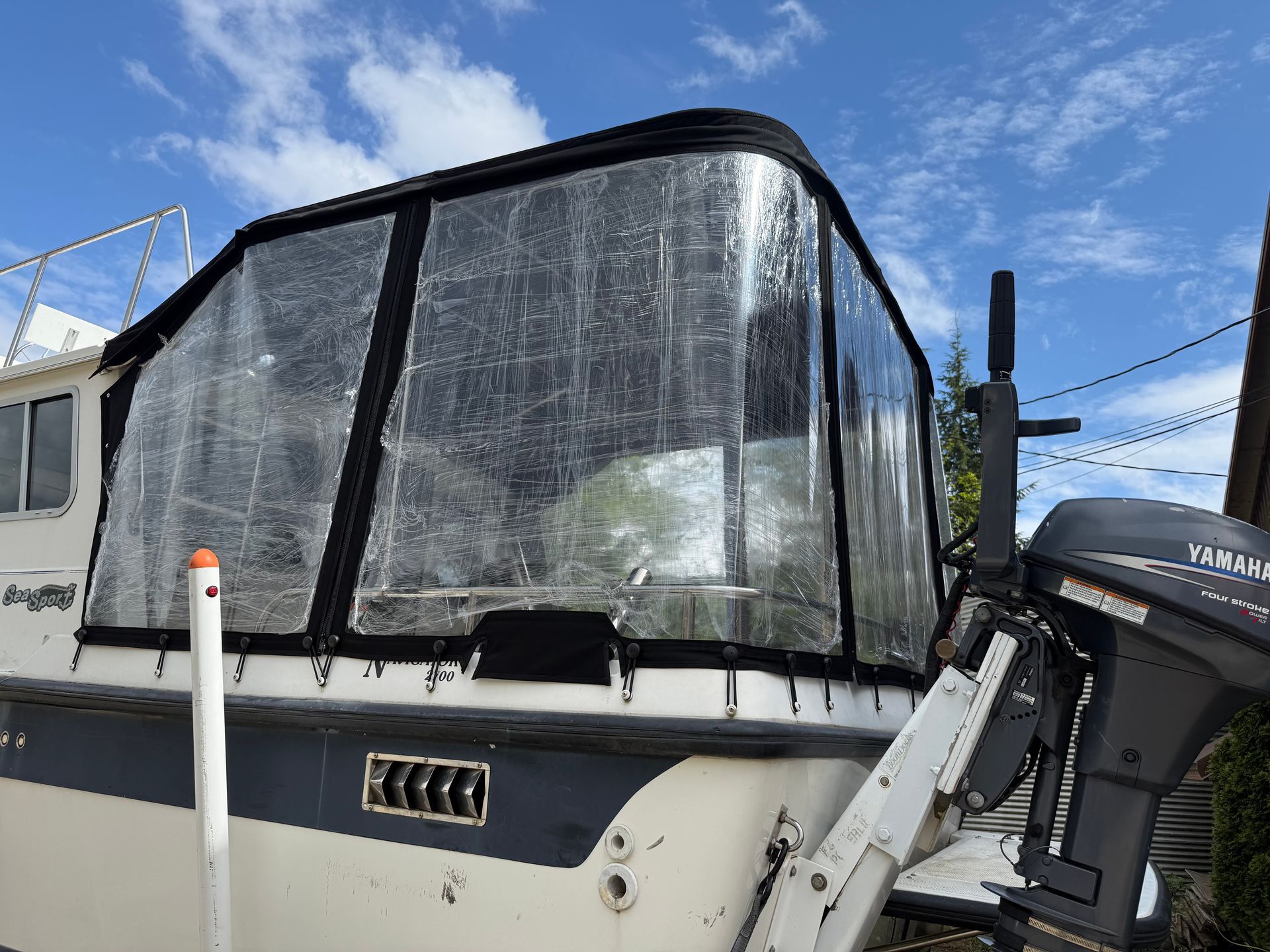 Fitted black canvas and clear vinyl stern enclosure