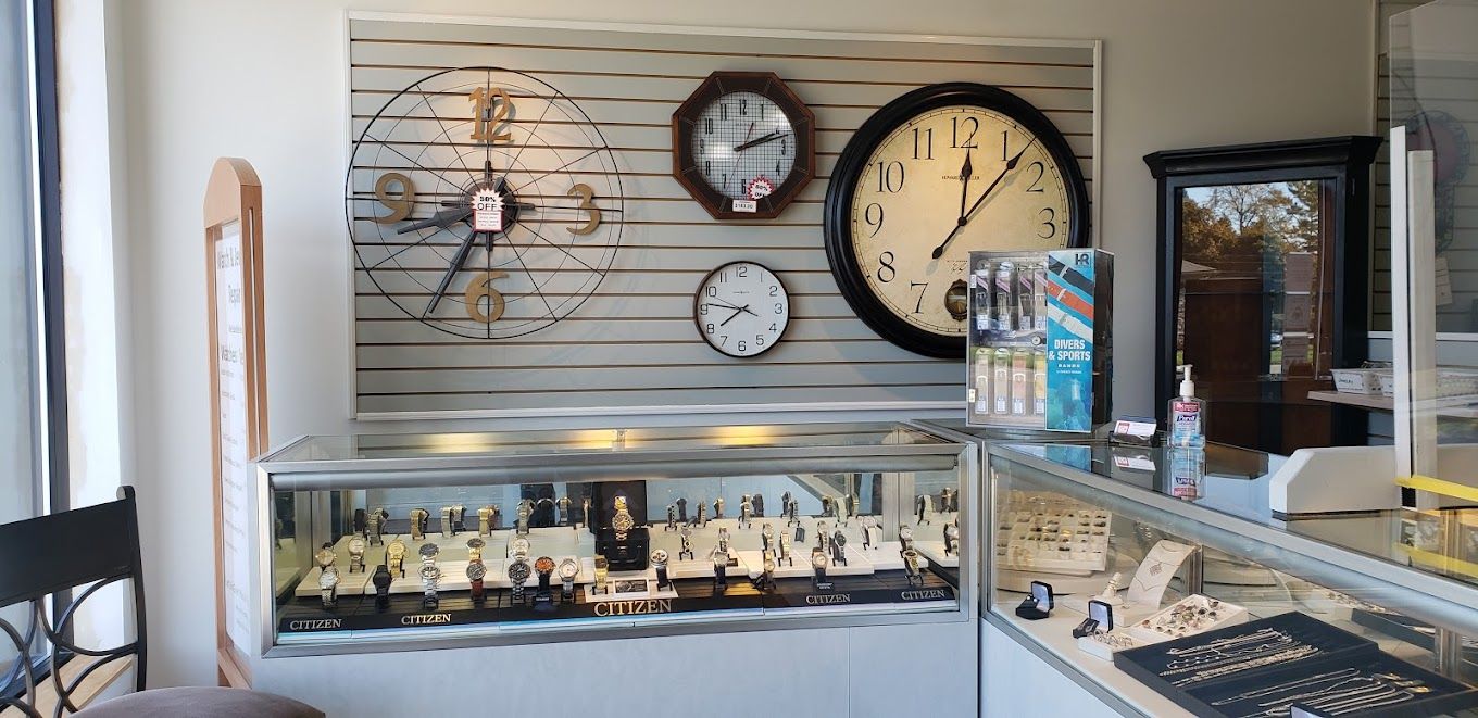 there are many clocks on the wall in this store .