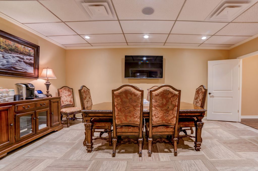 There is a large table and chairs in the room.