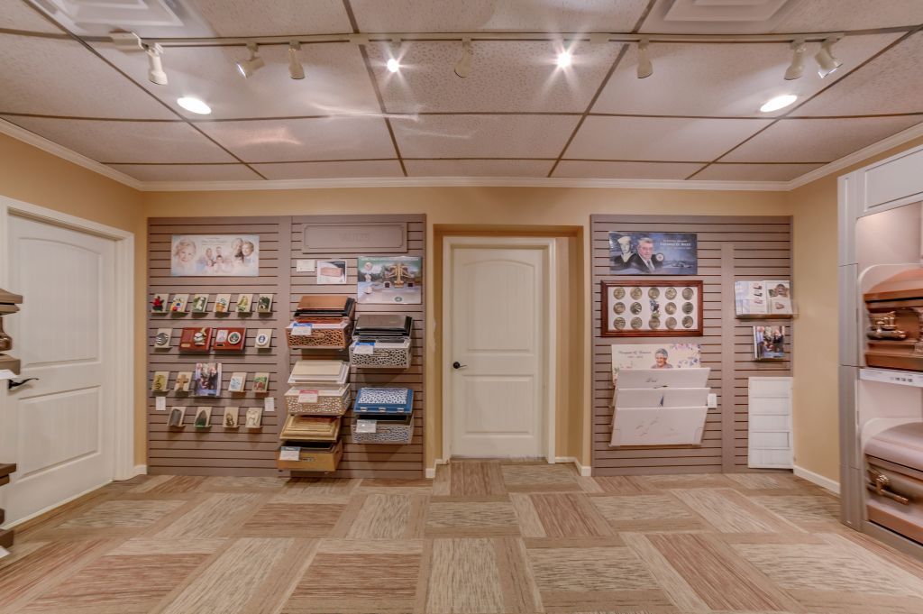 A room with a carpeted floor and a lot of shelves