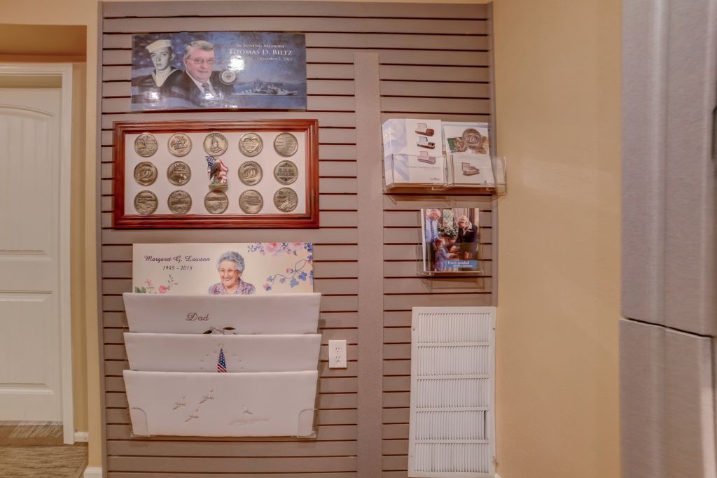 A wall with a picture of a man and a picture of a woman on it.