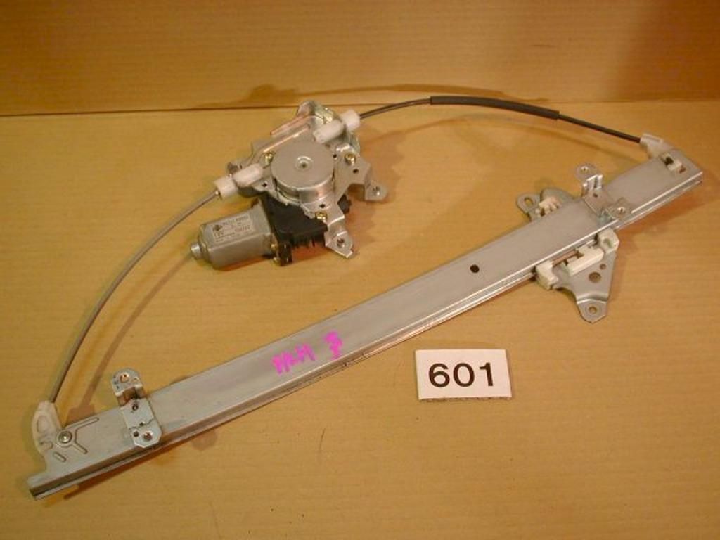 A window regulator with the number 601 on it is sitting on a table.