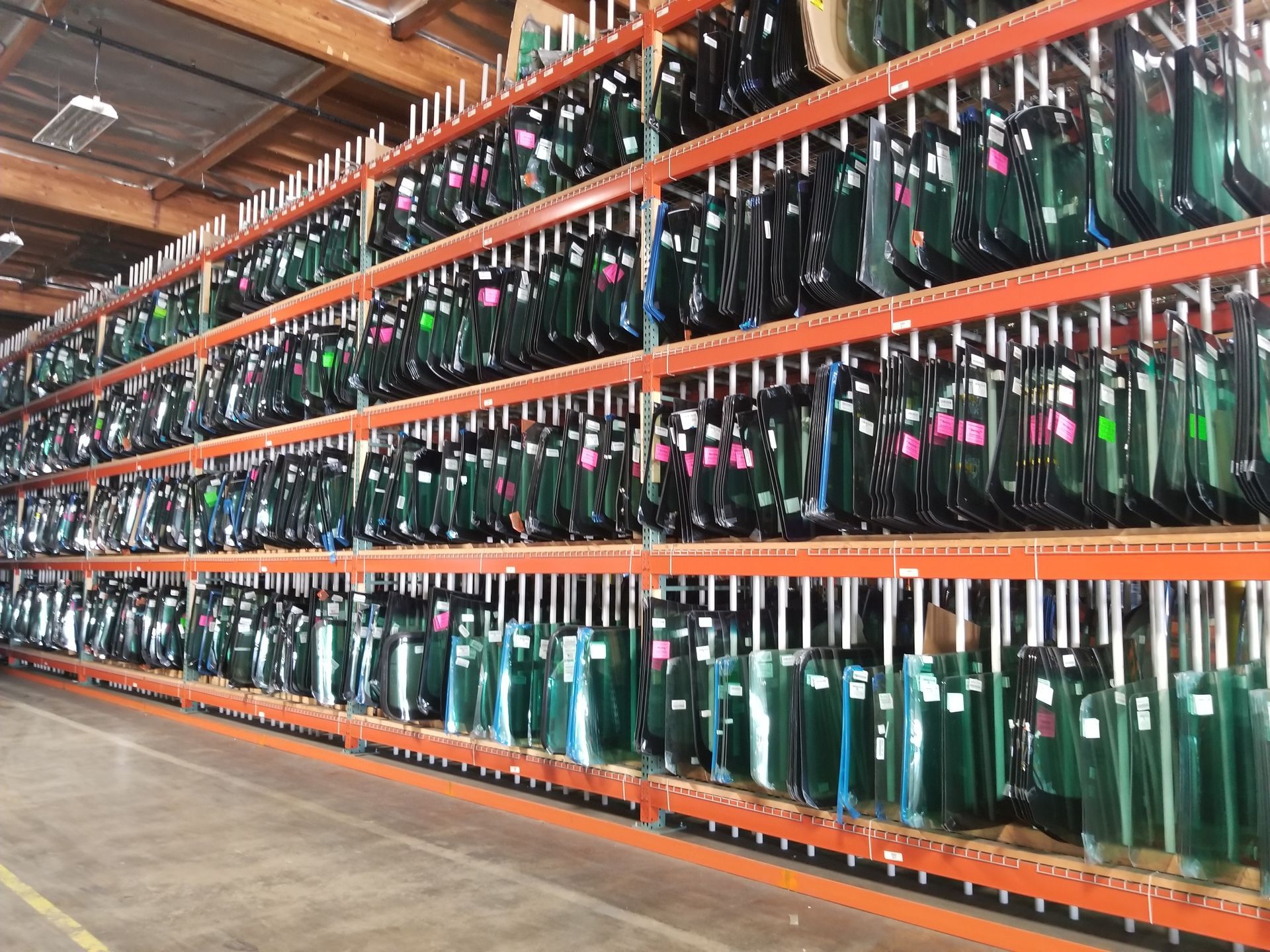 A warehouse filled with lots of different types of glass