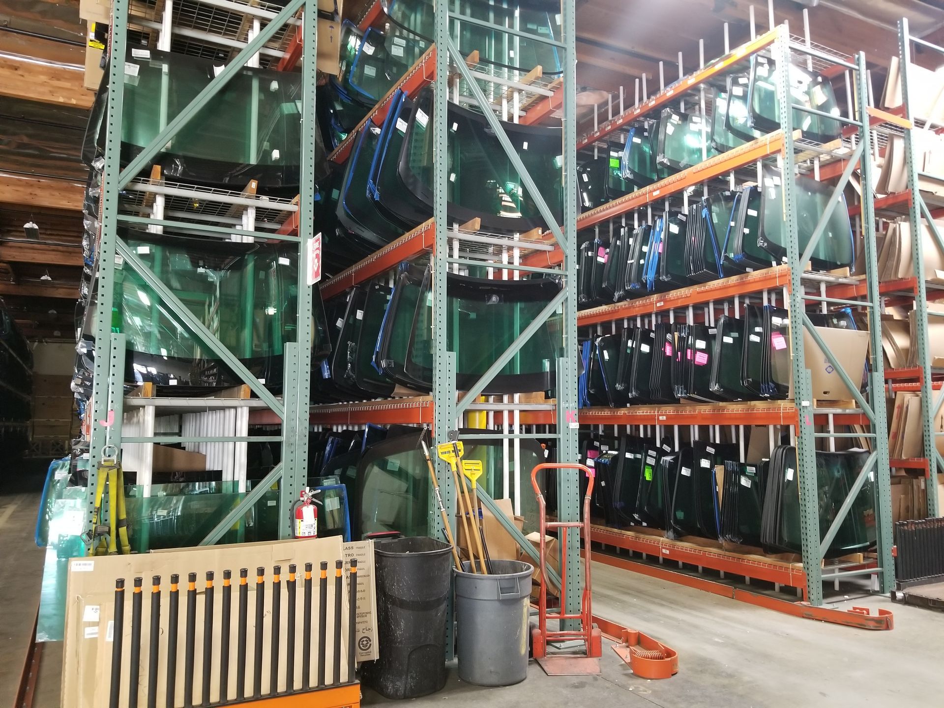A warehouse filled with lots of different types of glass
