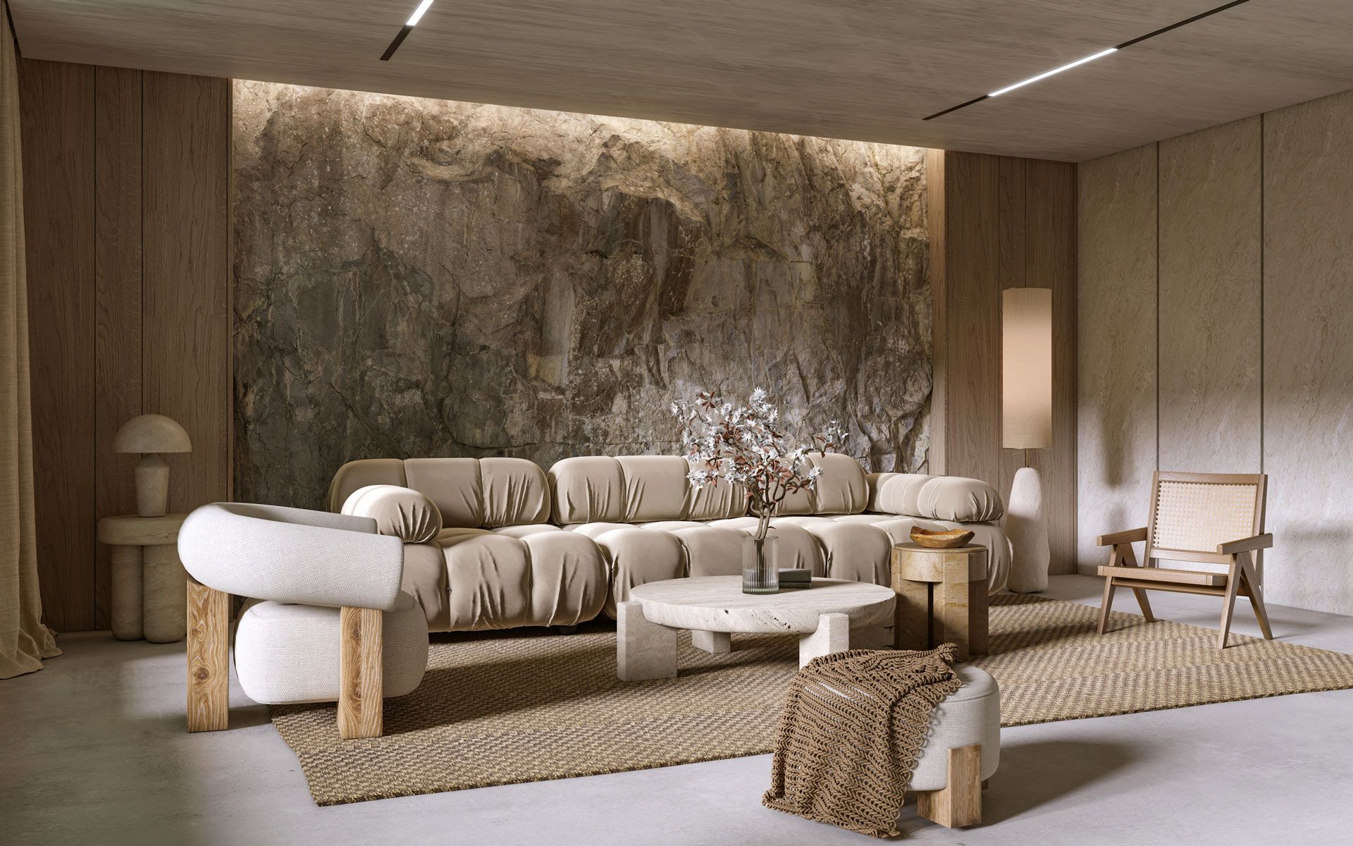 Living room with stone wall, beige sofa, and natural wood furniture.