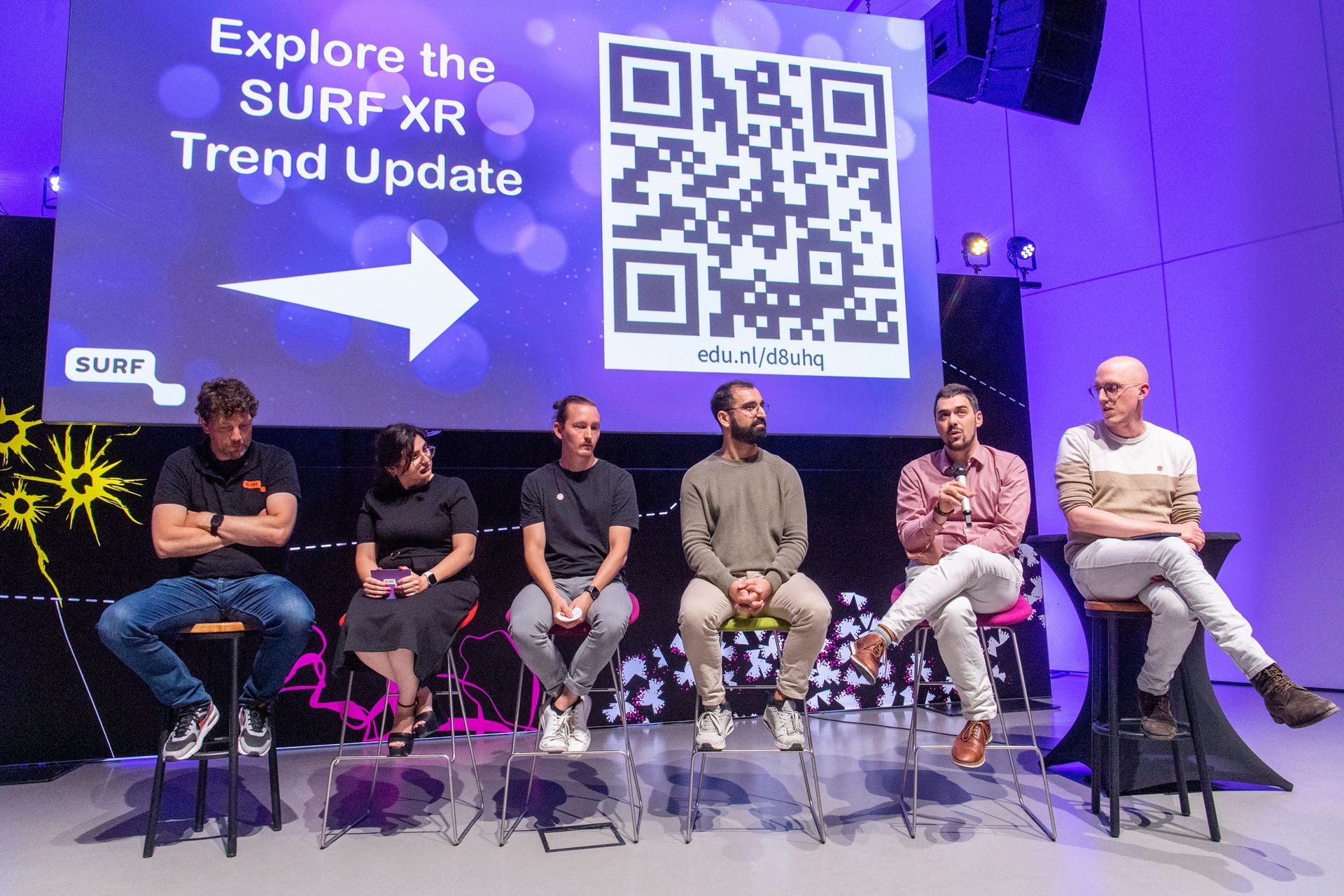 Sprekers presenteren tijdens National XR Day, een kennisevent over Extended Reality, georganiseerd door Plan X Events.