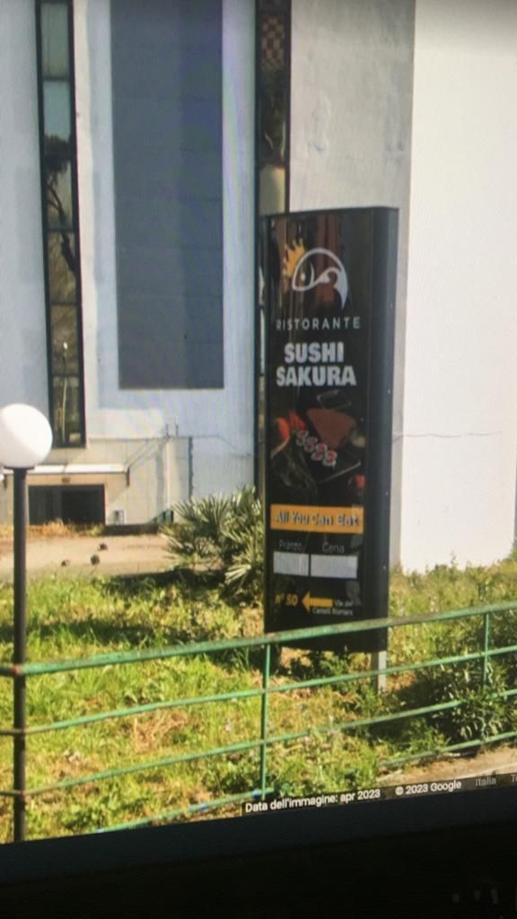 insegna luminosa a bandiera