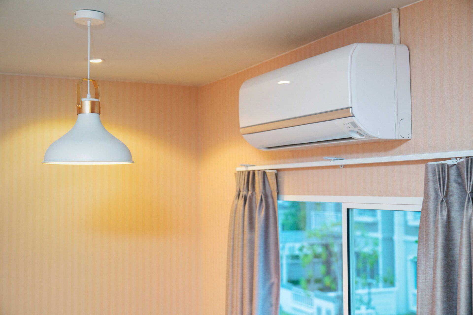 Air conditioner on wall — Irwin, PA — Jordan Comfort Solutions LLC