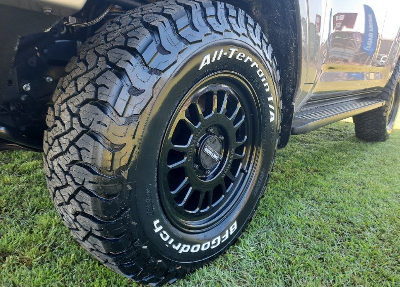 A Close Up Of A Tire On A Car On A Grassy Field — Clarence Valley Tyre Centre in South Grafton, NSW