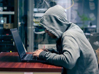Man in front of a laptop — Springfield, TN — The Law Office of Joe R. “Jay” Johnson, II