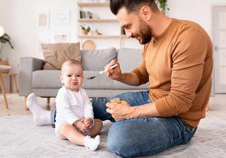 Father Feeding the Baby — Springfield, TN — The Law Office of Joe R. “Jay” Johnson, II Father Feeding the Baby — Springfield, TN — The Law Office of Joe R. “Jay” Johnson, II