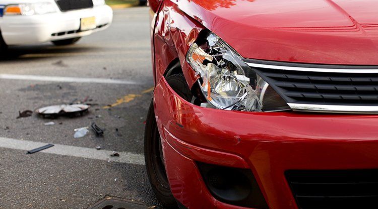 Damaged Red Car — Springfield, TN — The Law Office of Joe R. “Jay” Johnson, II Damaged Red Car — Springfield, TN — The Law Office of Joe R. “Jay” Johnson, II