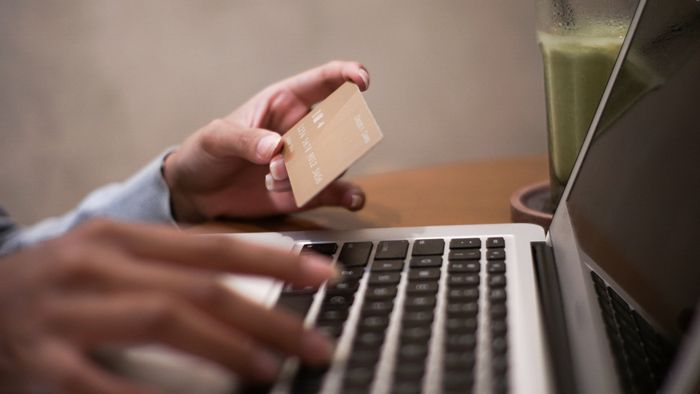 Holding Credit Card While Typing — Santa Barbara, CA — Law Offices of Karen L. Grant Holding Credit Card While Typing — Santa Barbara, CA — Law Offices of Karen L. Grant
