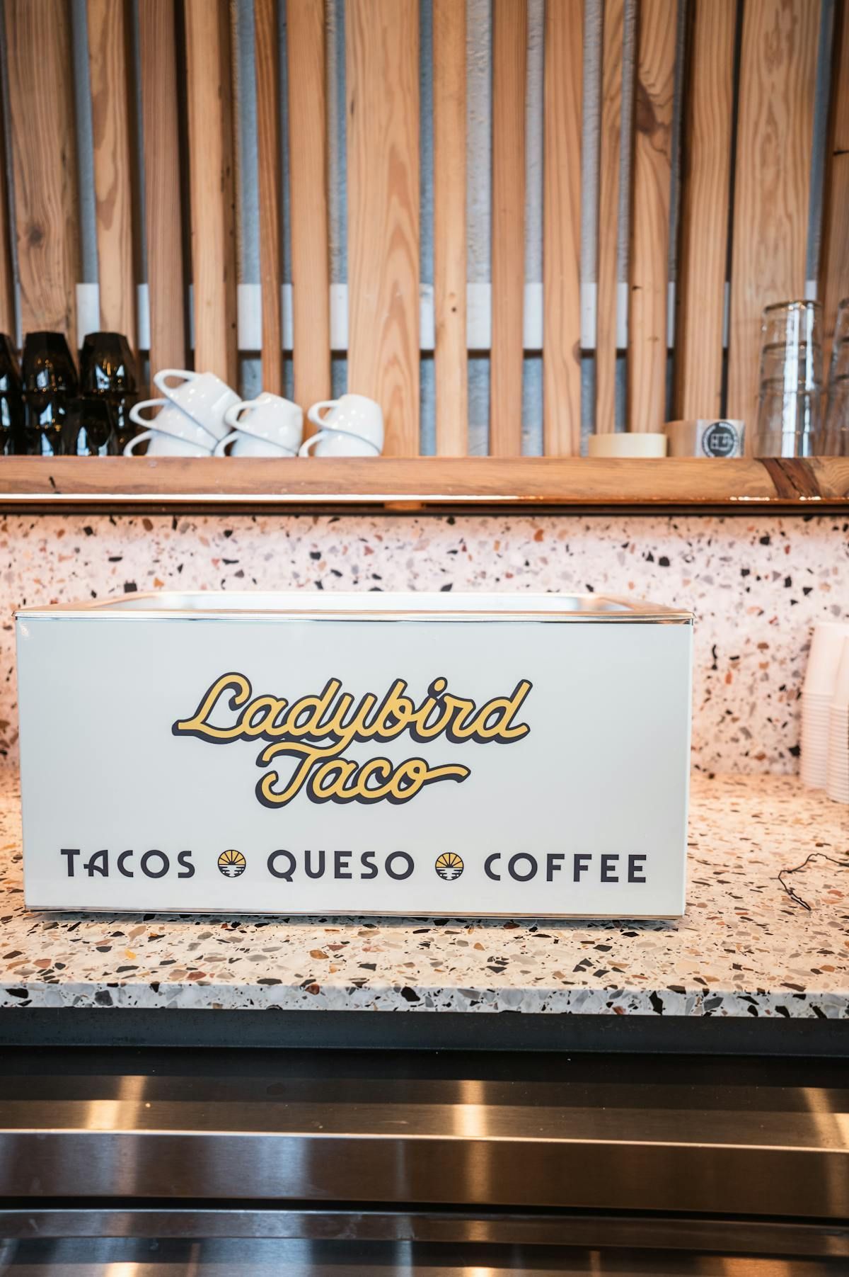 A white Ladybird Taco counter display featuring the text 